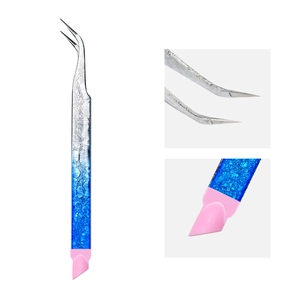 Macro detail of blue gradient textured stainless steel tweezers with pink silicone head