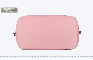 Detail view of pink waterproof travel bag bottom with reinforced stitching and smooth zippers
