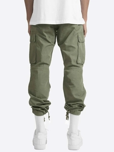 Rear view of army green cargo pants featuring flap pockets and adjustable drawstring cuffs