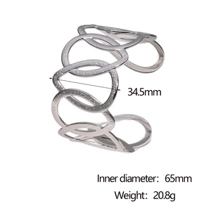 Detail view of hollow intertwined silver bangle showing 34.5mm width and 65mm diameter