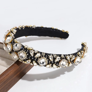 Close-up of a luxury headband featuring sparkling rhinestones on a premium black fabric base