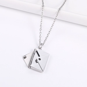 Detailed close-up of a silver envelope necklace pendant with an opening cover feature
