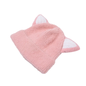 Detail of pink knitted hat featuring plush cat ears and soft warm lining for kids