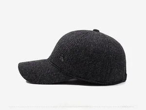 Side view of dark gray knit wool baseball cap with metallic SR logo for winter