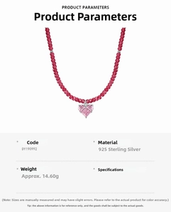 Macro detail of S925 sterling silver necklace with pink heart crystal and red beaded chain