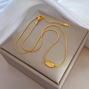 Gold geometric bean pendant on sleek snake chain necklace made of durable stainless steel