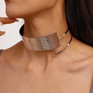 Detail of silver double-layer choker with hammered texture on a model neck