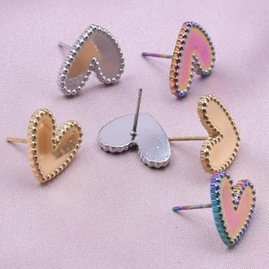 Detailed view of heart-shaped earrings with beaded edges in assorted colors and finishes