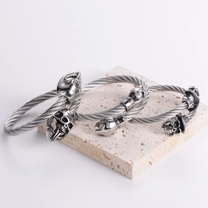 Three-piece set of adjustable stainless steel cable bracelets with gothic skull heads