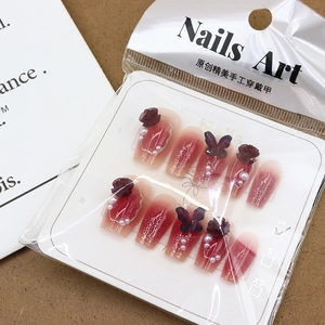 Handmade camellia and butterfly press-on nails with red gradient and glitter finish