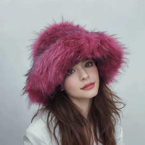 Close-up of thick faux fur texture on a vibrant rose red winter bucket hat for women