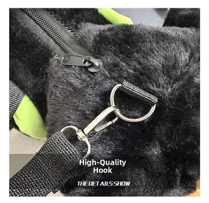 Detail of premium silver metal swivel hook and black nylon strap on plush bag