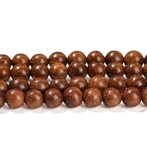 Natural dark brown sandalwood round beads with organic texture and polished finish
