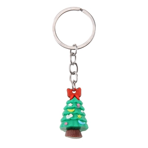 Creative Christmas tree keychain with red bow and green silicone pendant on white background