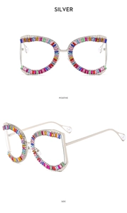 Macro detail of silver sunglasses frames with rainbow rhinestones and pearl tips