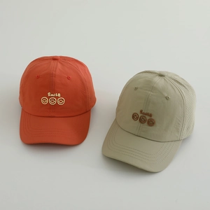 Kids quick-dry baseball caps with three smiley faces embroidery in orange and beige colors