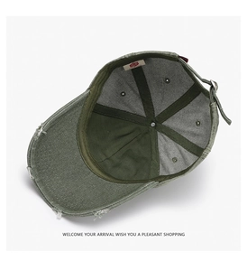 Detailed interior of dark green vintage baseball cap showing stitching and label