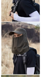 Detail of olive green sun hat with face cover and white cooling arm sleeves for outdoors