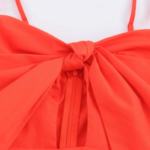 Orange sweet vacation style sundress with large front bow and functional zipper detail