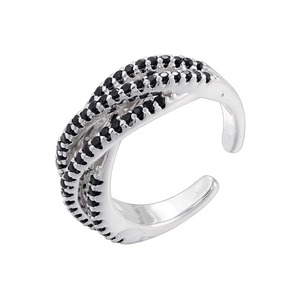 Close-up of luxury crisscross adjustable ring with black pave-set zircons on silver metal
