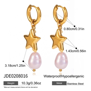 Detail view of 18K gold plated stainless steel star earrings with Baroque pearl drops