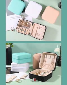 Detail of travel jewelry box showing ring slots, necklace hooks, and compact storage