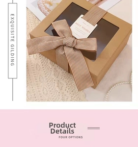 Detail of a brown gift box with clear window, striped ribbon bow and a Best Wishes card