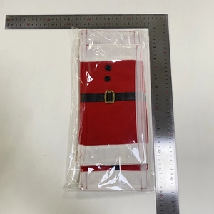 Detailed macro view of red plush Santa suit fridge handle covers with belt buckles