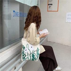Japanese style chamomile print canvas tote bag with Don't Ever Change script text
