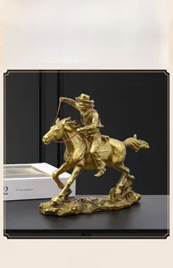 Detailed close-up of golden resin cowboy statue with vintage European luxury finish