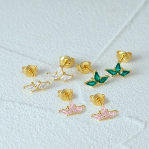 Macro shot of 925 silver stud earrings with white, green and pink marquise-cut stones