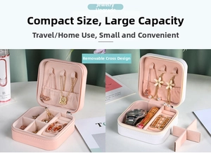 Detail of pink and white PU leather jewelry box with removable dividers and necklace hooks