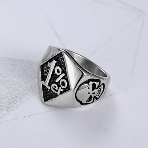 Macro detail of 1%er logo and skull embossing on vintage silver biker ring