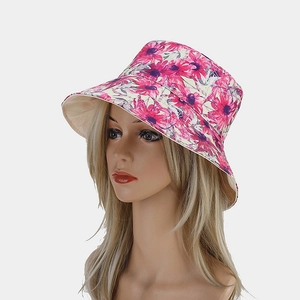 Close-up of floral sunflower print on reversible sun hat with premium canvas texture