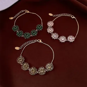 Bracelet fleurs plaqué or 18 carats avec zircons en vert, clair et champagne