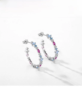 Macro detail of S925 sterling silver C-hoop earrings with multi-color zircon stones