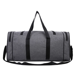Detailed view of grey Oxford fabric travel bag showing durable handles and side zippers