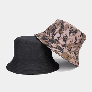 Detail of a black bucket hat layered over a digital camouflage sun hat in durable cotton