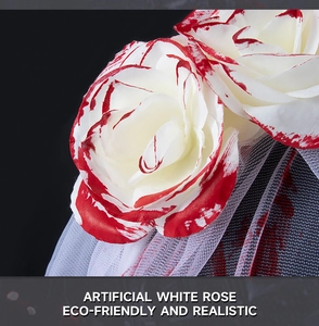 Detail of artificial white rose with blood splatter for Halloween gothic veil