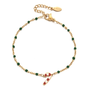 Detail of Christmas candy cane pendant on gold stainless steel bracelet with green beads