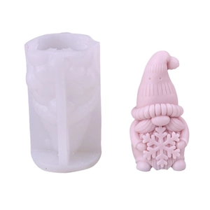 Silicone mold for Christmas gnome candle making with pink gnome statue example