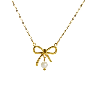 Elegant gold bow necklace with white pearl pendant on a delicate link chain