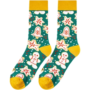 Close-up of green knit Christmas socks with gingerbread man and bell festive patterns