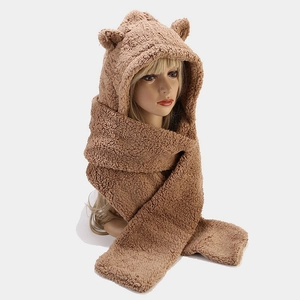 Detailed texture of brown faux fur hooded scarf with cute bear ears for winter warmth