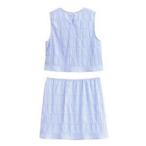 Flat lay of blue checkered two-piece set featuring sleeveless top and mini skirt