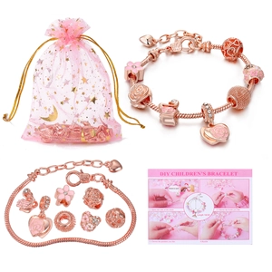 Detail of rose gold DIY bracelet kit with floral charms, pink enamel, and 16cm chain length