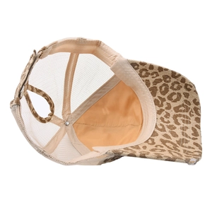 Distressed leopard print ponytail mesh trucker hat with breathable fabric and vintage style