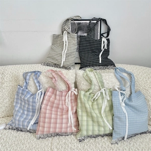 Close-up of six color options for the plaid tote bag featuring lace bows and wavy edges