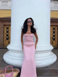 Elegant pink ribbed knit maxi dress with thin spaghetti straps in a slim fit silhouette