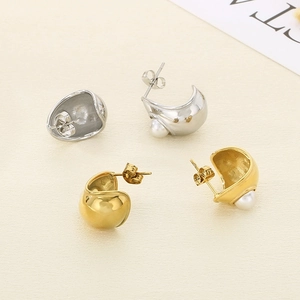 Minimalist C-shaped stainless steel earrings in gold and silver finish with white pearls